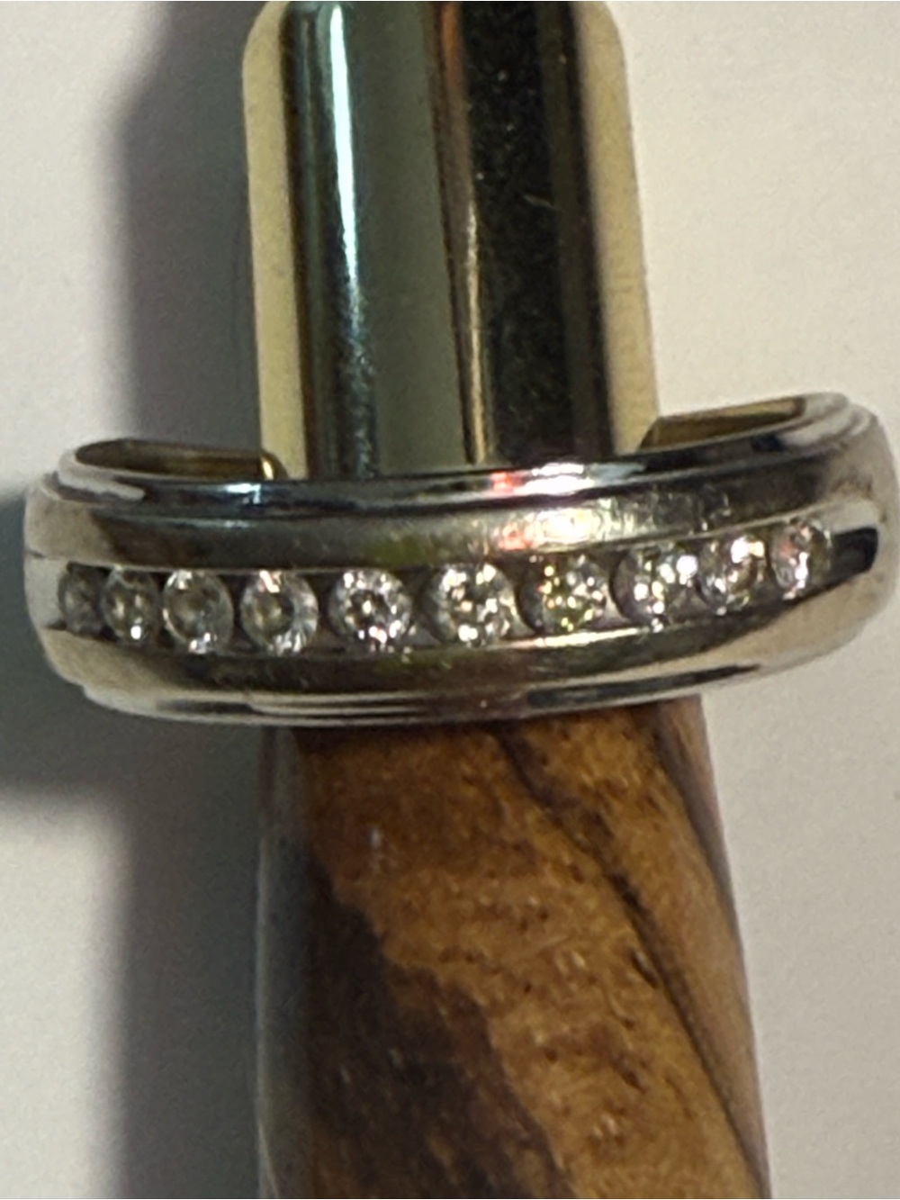 Men’s 14k channel set diamond wedding band in good condition.